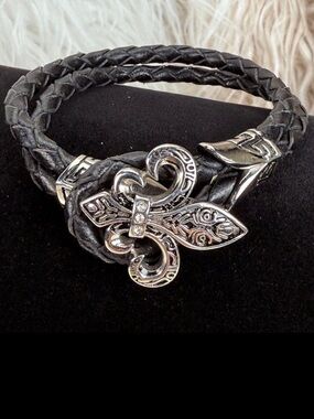 Beautiful, black braided silvertone Fleur di Lis toggle closure costume bracelet